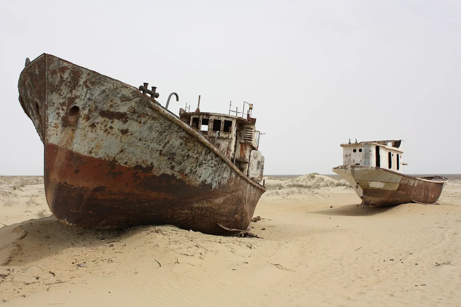 Rusting fishing boats on the dry bed of the Aral Sea at Moynaq